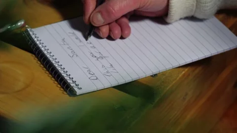 Writing a letter to Santa on notepad Stock Footage 327221411