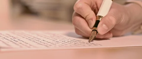 Writing a letter while camera is moving Stock Footage 120942783