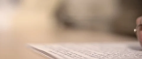 Writing a letter while camera is moving Stock Footage 120945687