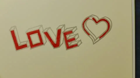 Writing love in stop motion Stock Footage 62305053