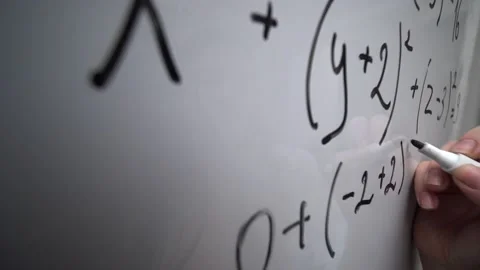 Writing mathematics equation on whiteboard, math formula, education concept Stock Footage 146470884