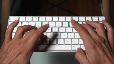 Writing a message on the computer keyboard - millennials' addiction to the inter Vídeos de archivo 253565904