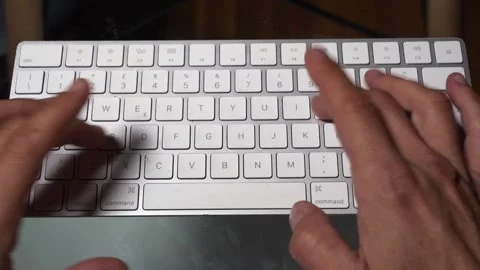 Writing a message on the computer keyboard - millennials' addiction to the inter Vídeos de archivo 253565906