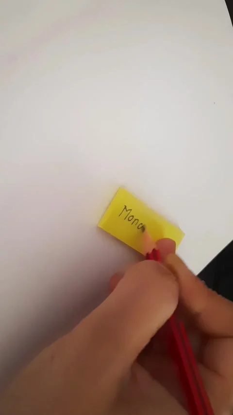 Writing "Monday" on Yellow Sticky Note – Weekly Planning Concept 動画素材 340143541