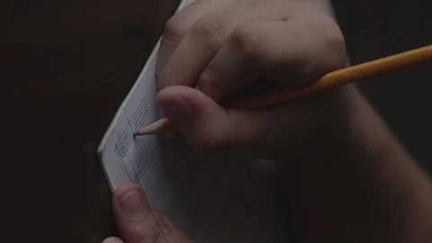 Writing musical notes on a paper in slow motion and shot in vertical video. Stock Footage 92761785