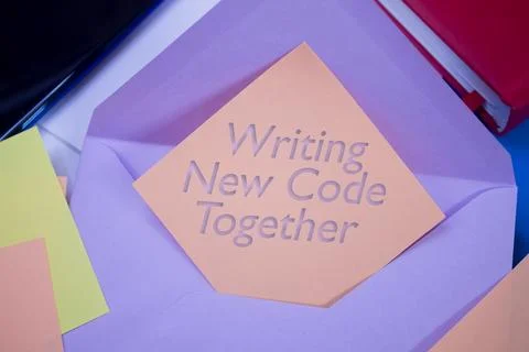 Writing New Code Together. Text on adhesive note paper. Event, celebration .. Foto stock