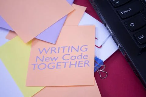 Writing New Code Together. Text on adhesive note paper. Event, celebration .. Stock Photos