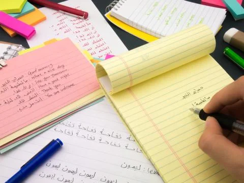 Writing New Language; Arabic Stock Photos