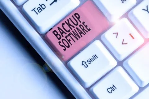 Writing note showing Backup Software. Business photo showcasing create extra Foto stock