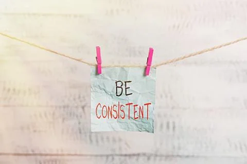 Writing note showing Be Consistent. Business photo showcasing Uniform Persistent Stock Photos