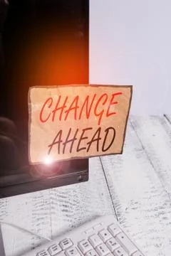 Writing note showing Change Ahead. Business photo showcasing to replace with or Foto stock