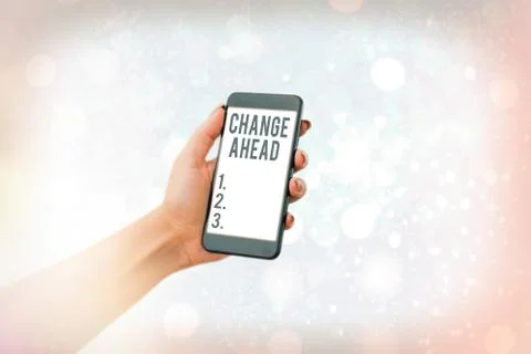 Writing note showing Change Ahead. Business photo showcasing to replace with or Foto stock