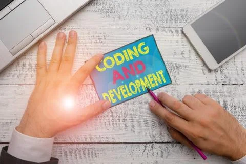 Writing note showing Coding And Development. Business photo showcasing Stock Photos