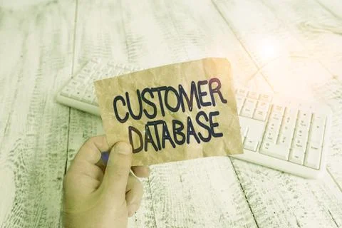 Writing note showing Customer Database. Business photo showcasing uptodate on Stock Photos