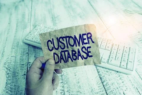 Writing note showing Customer Database. Business photo showcasing uptodate on Stock Photos