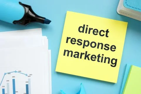 Writing note showing direct response marketing. The text is written on a paper Stock Photos
