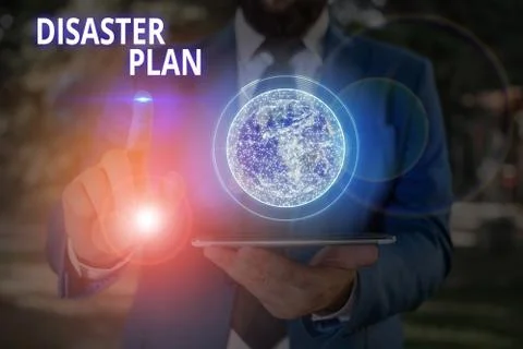 Writing note showing Disaster Plan. Business photo showcasing outlines how an Stock Photos