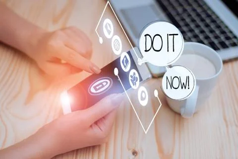 Writing note showing Do It Now. Business photo showcasing not hesitate and start Stock Photos