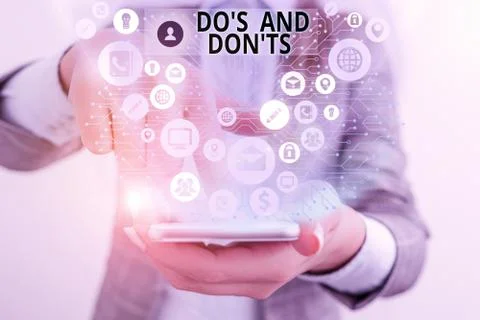 Writing note showing Do S And Don Ts. Business photo showcasing Technologically Stock Photos