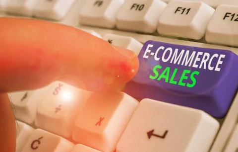 Writing note showing E Commerce Sales. Business photo showcasing activity of Stock Photos