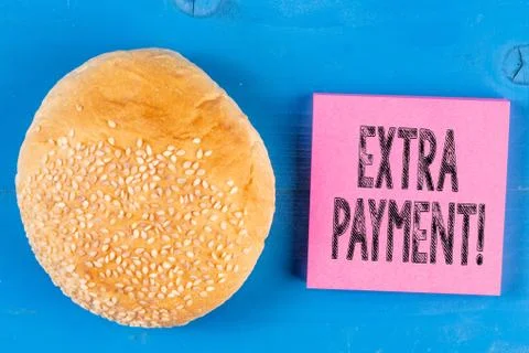 Writing note showing Extra Payment. Business photo showcasing pay extra money in Stock Photos