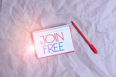 Writing note showing Join Free. Business photo showcasing the act or an instance Stock Photos
