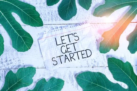 Writing note showing Let S Get Started. Business photo showcasing To begin doing Stock Photos