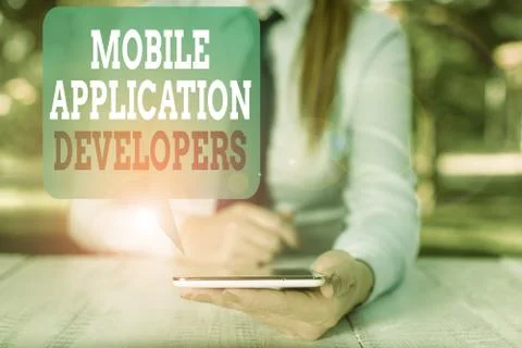 Writing note showing Mobile Application Developers. Business photo showcasing Stock Photos