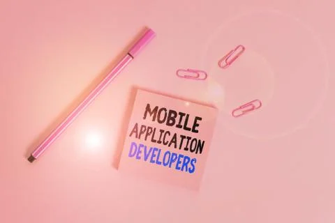 Writing note showing Mobile Application Developers. Business photo showcasing Stock Photos