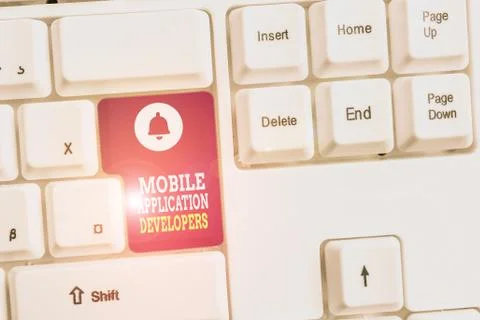 Writing note showing Mobile Application Developers. Business photo showcasing Foto stock