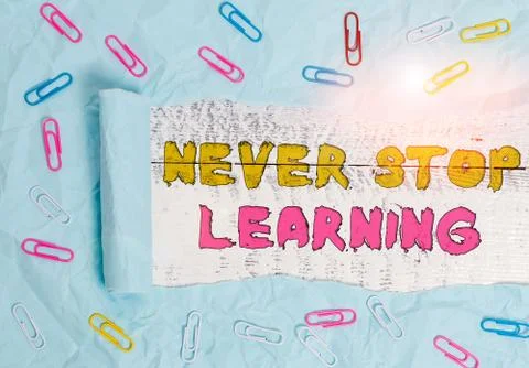 Writing note showing Never Stop Learning. Business photo showcasing Continue to Stock Photos