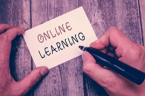 Writing note showing Online Learning. Business photo showcasing Larning with  Foto stock