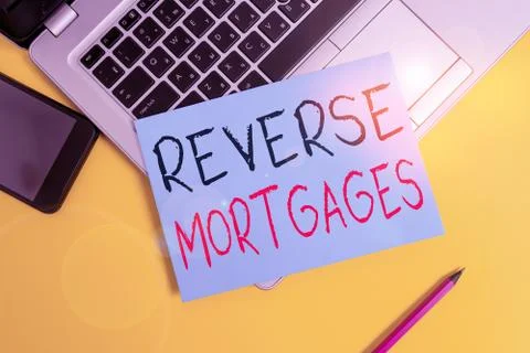 Writing note showing Reverse Mortgages. Business photo showcasing borrower to Fotos Stock