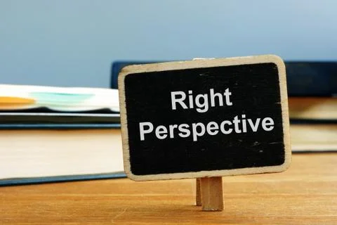 Writing note showing Right Perspective. The text is written on a small wooden Stock Illustration
