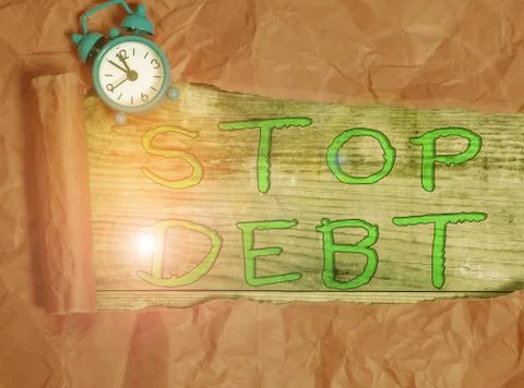 Writing note showing Stop Debt. Business photo showcasing does not owning any Stock Photos
