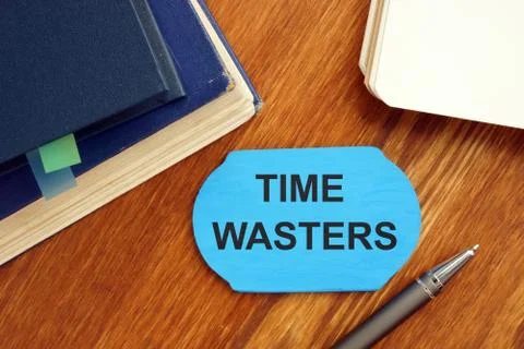 Writing note showing time wasters. The text is written on a small wooden boar Stock Illustration