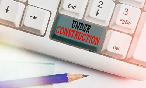 Writing note showing Under Construction. Business photo showcasing building that Stock Photos