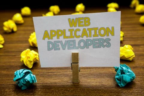 Writing note showing Web Application Developers. Business photo showcasing Stock Photos