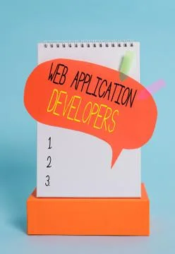 Writing note showing Web Application Developers. Business photo showcasing 库存照片