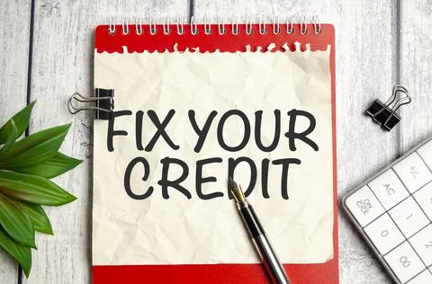 Writing note shows the text Fix your credit Fotos de archivo
