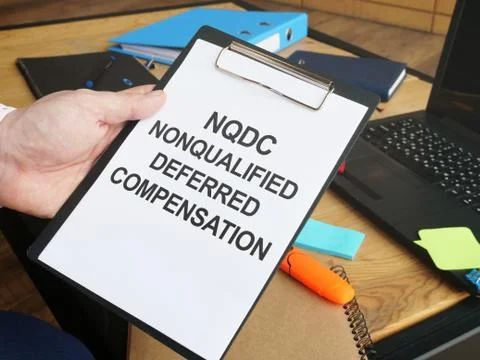 Writing note shows the text nonqualified deferred compensation NQDC Stock Photos