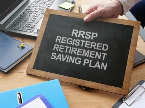 Writing note shows the text RRSP Registered Retirement Saving Plan Stock Photos