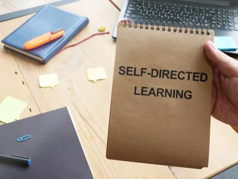 Writing note shows the text Self-directed learning Stock Photos
