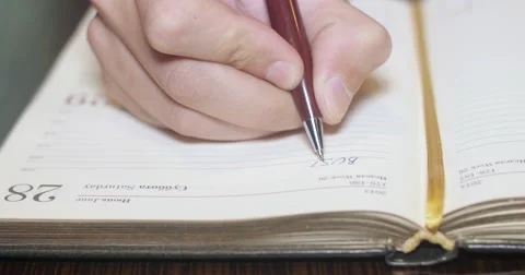 Writing in a notebook. Stock Footage 52273560