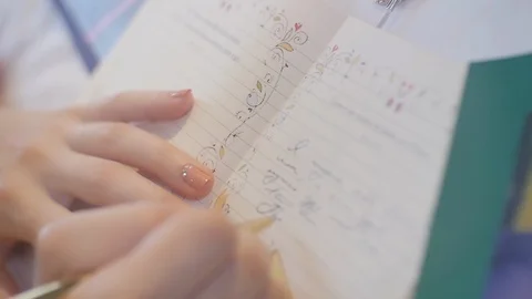 Writing in notebook Stock Footage 123513784
