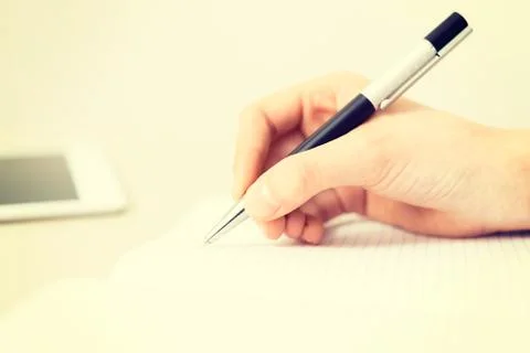 Writing in a notebook Stock Photos