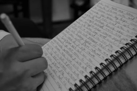 Writing on a notebook Stock Photos