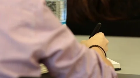 Writing in notepad Stock Footage 77048530