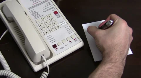 Writing on notepad by hotel phone V2 - HD 스톡 동영상 1004017