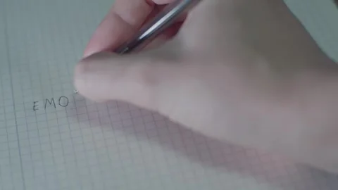 Writing in a notepad with the word emotion Stock Footage 265176468